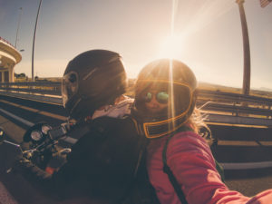couple riding a motorcycle couple riding a motorcycle